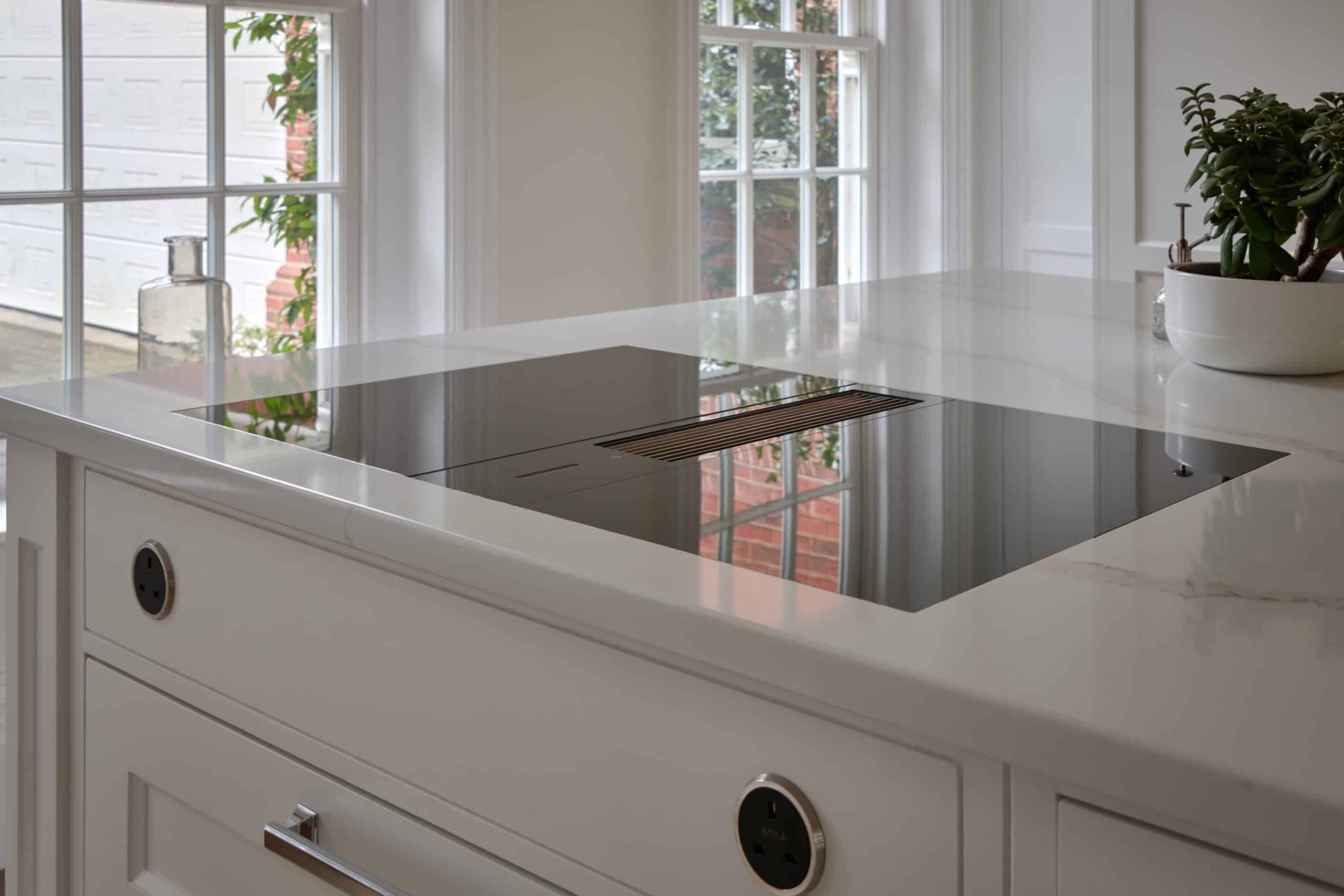 Bespoke handmade kitchen with a BORA hob and handmade cabinetry and Carrara marble worktop.